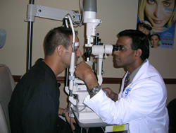 A doctor performing a vision test